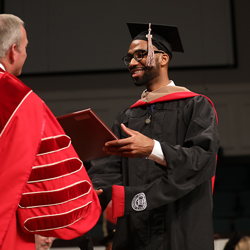 Jarren Meredith receives his diploma at Union University's summer commencement on July 27, 2019. (Photo by Kristi Woody)
