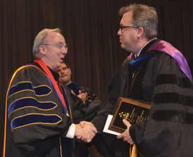 Union University President David S. Dockery congratulates Gavin Richardson (right), who was announced as the winner of the Faculty of the Year Award during the Awards Day ceremony May 4. (Photo by Morris Abernathy)