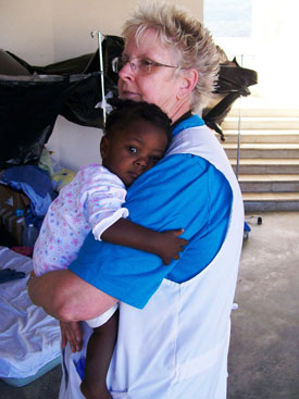 Patsy Crihfield, associate professor of nursing at Union, holds a Haitian child during a trip to Haiti earlier this year. 