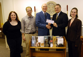 Stephen Carls, chairman of Union's department of history and political science, presents a check to library director Steve Baker for the purchase of new history books. Union's Phi Alpha Theta chapter won the money for being named best chapter by the national organization. Pictured from left are Cassaundra Harris, next year's Phi Alpha Theta president; Spencer Lowery, past president; Carls, Baker and Heather Tobe, current chapter president. (Photo by Morris Abernathy)