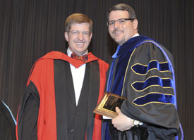 Keith Bates (right) associate professor of history, was announced as the winner of the Faculty of the Year Award during the Awards Day ceremony May 6. Bates is pictured with last year's winner, Ray Van Neste. (Photo by Morris Abernathy)