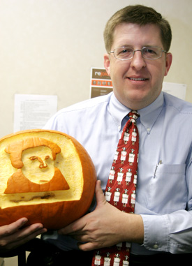 Ray Van Neste holds the "Luther-o-lantern" three of his students gave him on Reformation Day. (Photo by Kyle Kurlick)