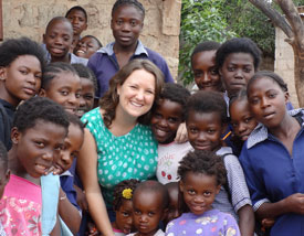 Whitney Morreau (Union class of 2006) with some of the Zambian children with whom her organization, Impact One Initiative, works.
