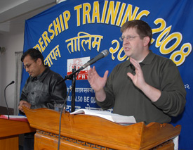 Christian studies professor Ray Van Neste teaches a group of pastors in Nepal, through a translator. 