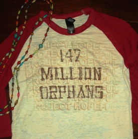 Players from nine teams in the NAIA women's basketball tournament will be wearing these T-shirts to raise awareness about the number of orphans in the world.