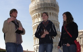 Union students Rob Alvey, Stephanie Netland and Abby Nolen give a presentation in front of the Leaning Tower of Pisa.
