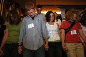 Union students pray during a chapel service to start the 2004-2005 school year. (Photo by Morris Abernathy)