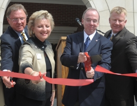 From left, Madison County Mayor Jimmy Harris, School of Pharmacy Dean Sheila Mitchell, Union President David S. Dockery and Board of Trustees Chairman Rod Parker cut the ceremonial ribbon at the Providence Hall dedication Aug. 25. (Photo by Morris Abernathy)