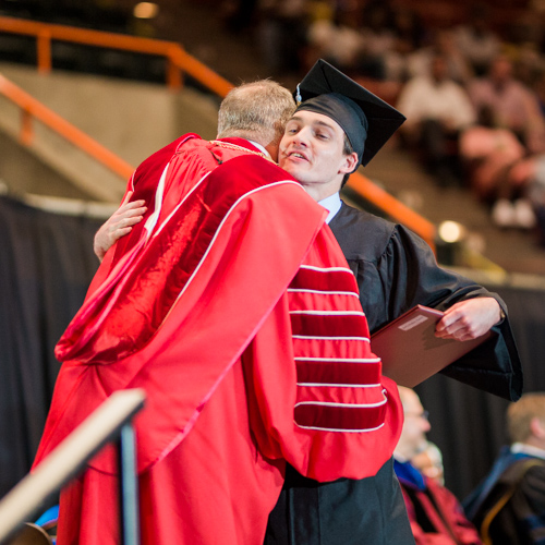 Union President Samuel W. "Dub" Oliver congratulates Seth Ratliff as he receives his certificate of completion at spring commencement May 20. (Photo by Kristi Woody
