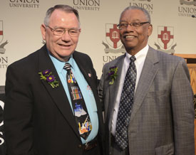 Charles Baldwin (left) and Roland Porter were honored at a retirement reception May 16. Sherry Hickey, who is also retiring, was unable to attend. (Photo by Morris Abernathy)