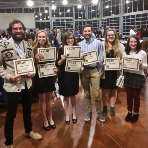 Cardinal & Cream staff members (from left) Gabe Hilliard, Ali Renckens, Danica Smithwick, Caleb Lay, Abby Duke and Kallan Parker pose with awards won by the newspaper staff at the Southeastern Journalism Conference.