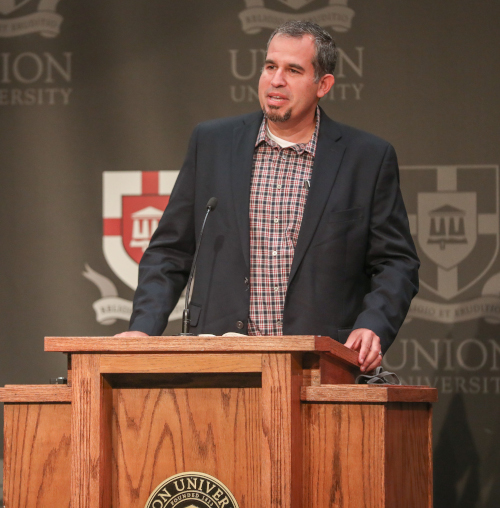 Orlando Lobaina, dean of Union's School of Adult and Professional Studies, leads a devotional for trustees prior to their Sept. 11 meeting. (Photo by Kristi Woody)