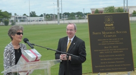 Nancy Smith New speaks at the dedication for the Smith Memorial Soccer Complex, while Union President David S. Dockery listens. (Photo by Morris Abernathy)