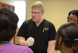 Tim Smith, dean of Union's School of Nursing, teaches a group of nursing students. Union's online graduate nursing program was recently ranked one of the best in the nation by U.S.News & World Report. (Photo by Morris Abernathy)