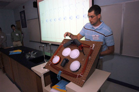 David Foster, a senior engineering major, discusses his engineering research project at the Scholarship Symposium. (Photo by Morris Abernathy)