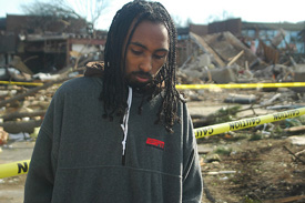 Mikias Mahommed reacts after viewing his devastated dorm room for the first time.  Mahommed was trapped under rubble for some time.  Photo by Matthew Diggs