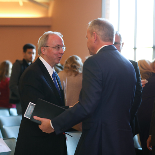 Former Union University President David S. Dockery greets Union President Samuel W. "Dub" Oliver at a Founder's Day chapel marking the 10-year anniversary of the Feb. 5, 2008, tornado. (Photo by Kristi Woody)