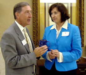 Nancy Zambito, newly appointed superintendent of schools for Jackson-Madison County, accepts an “Ed.D mug” from Tom Rosebrough, dean of the College of Education and Human Studies.