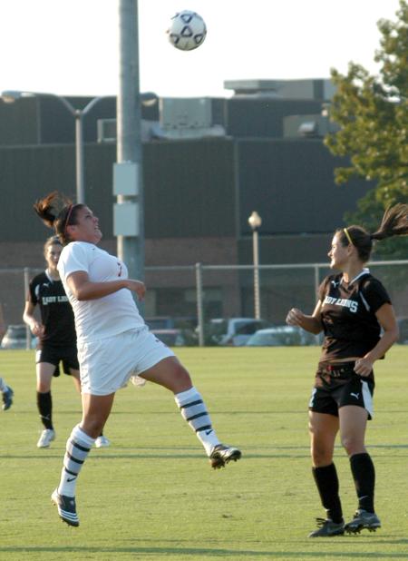 Bridget Roney jumps to attempt to control the possession of the ball. - Photo by Tommy Sadler