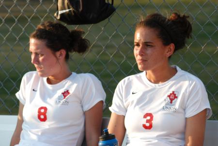 Roxanna Skelton (8) and Julie Ocampos-Barry (3) rest during halftime of Union's win over Freed-Hardeman. - Photo by Tommy Sadler