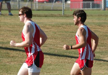 Josh Abbotoy (right) and Grant Luke warm up prior to the Union University Cross Country Invitational. - Photo by Steven Aldridge