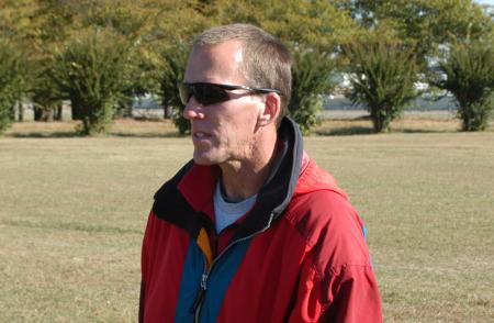 Union head cross country coach watches the events of the day during the Union University Cross Country Invitational. - Photo by Steven Aldridge