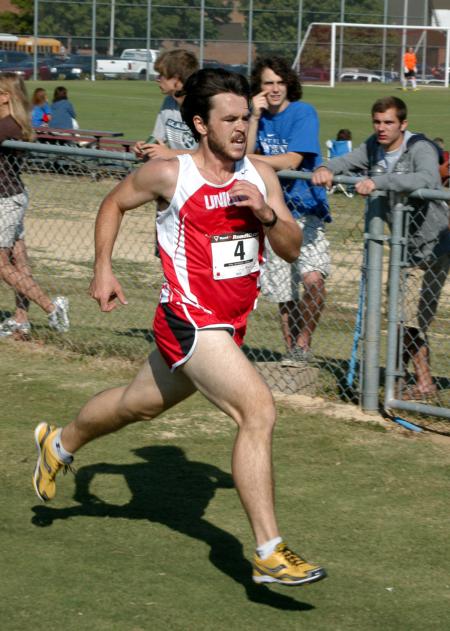 Josh Abbotoy crosses the finish line during the Union University Cross Country Invitational. - Photo by Steven Aldridge