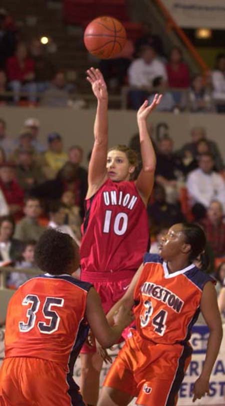 Union's Jessica Henson goes up for a shot during the first game in the NAIA tournament. #34 Langston Kayla Smith and #35 Taoshala Grant watch. Photo Stephan Frazier/The Jackson Sun - Photo by Stephan Frazier