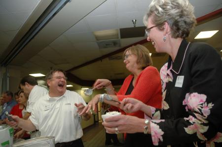 Gary Williams, Carla Sanderson and Barbara McMillin have some fun while serving ice cream to the Freshman class during Focus. - Photo by Beth Spain