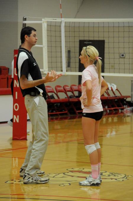 Union Head Coach Steven Gream talks strategy with setter Katie Adams. - Photo by Morris Abernathy