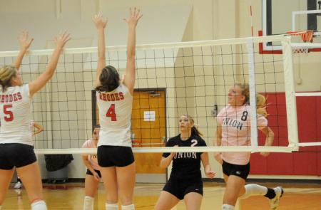 Amanda Coyle follows through after a kill attempt.  Coyle moved into second place on Union's all-time kills list. - Photo by Morris Abernathy