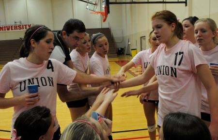 Coach Gream and his team breaks the huddle prior to a game. - Photo by Morris Abernathy