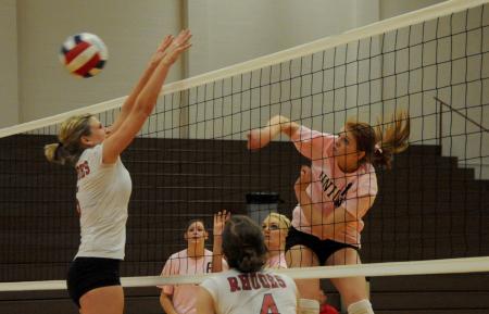 Anna Sims goes for a kill in a match versus Rhodes (Tenn.) College. - Photo by Morris Abernathy