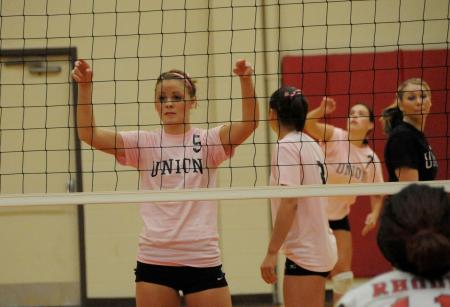 Ashley Young (5) awaits the serve from her teammate, Lindsey Wallach (7) - Photo by Morris Abernathy