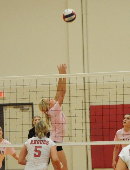 Katie Adams sets the ball for a teammate during a match versus Rhodes (Tenn.) College. - Photo by Morris Abernathy