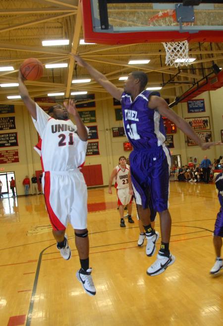 Brian Lake shoots over a defender from Bethel (Tenn.) College. - Photo by Morris Abernathy