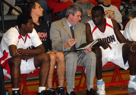 Union assistant coach Dave Niven instructs players on the bench before they go back into the game. - Photo by Morris Abernathy