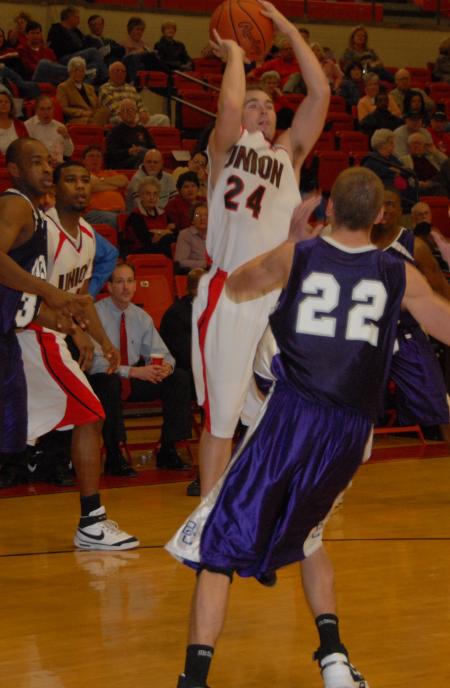 Junior guard Matt Neaville (24) shoots a jump shot over a Bethel (Tenn.) College defender. - Photo by Morris Abernathy