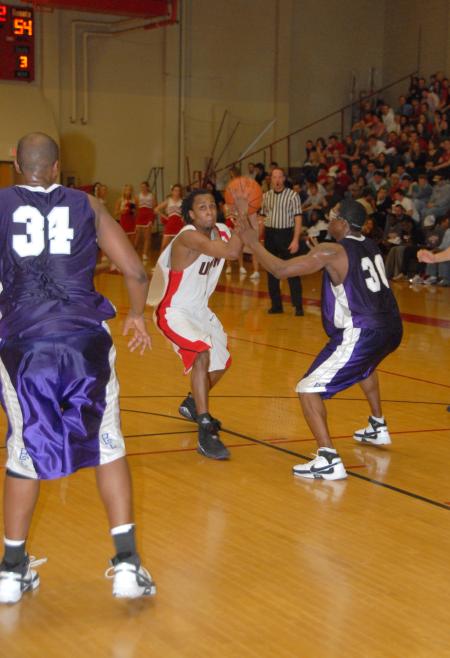 Tacuma Alexander, guard, prepares to take a shot over a defender from Bethel (Tenn.) College. - Photo by Morris Abernathy