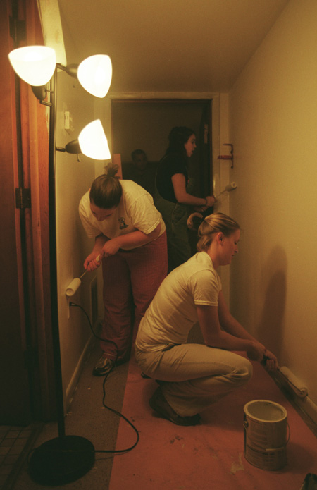 Union's Nikki Vassar (left), Heather Moellman (right) and Bekah Traynor (center, background) paint the education facility at University Baptist Church during GO Illinois. - Photo by Justin Veneman