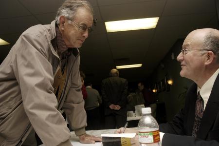 Jeremy Black, speaker for the 2009 Carls-Schwerdfeger Lecture, signs John Freeman's book for his son Lloyd, a Union alumni who is currently on his third tour of duty with the Marines. - Photo by Beth Spain