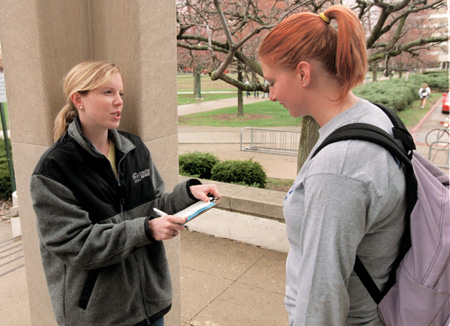 Union's Ashli Sutton surveys an Eastern Illinois University student during GO Illinois. - Photo by Justin Veneman