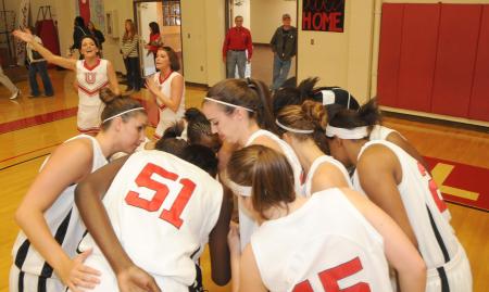 The Union Lady Bulldogs huddle prior to the tipoff in Union's Fred DeLay Gymnasium. - Photo by Morris Abernathy