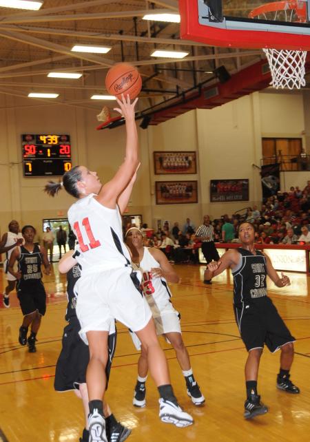 Kaitlin Dudley shows off her shooting touch with a shot along the baseline. - Photo by Morris Abernathy
