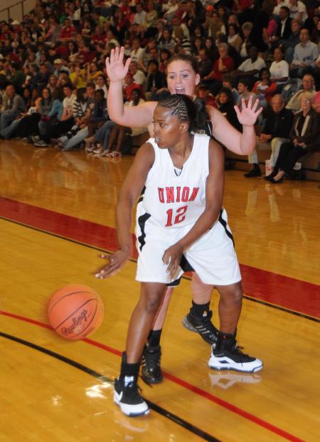 Junior guard Christina Ray passes the ball to a teammate in Union's Homecoming victory over St. Catharine (Ky.) College. - Photo by Morris Abernathy
