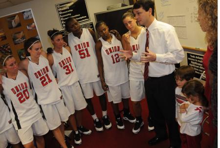 Mark Campbell, head coach, talks to his players during their post-game meeting. - Photo by Morris Abernathy