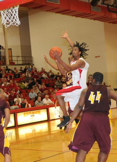 Tacuma Alexander, junior, drives to the basket during the 2008 Homecoming game versus Robert Morris (Ill.) College. - Photo by Morris Abernathy