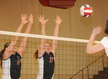 Emilie Ogas (6) and Anna Sims (17) go up for a block in Union's conference tournament win over Lyon. - Photo by Morris Abernathy