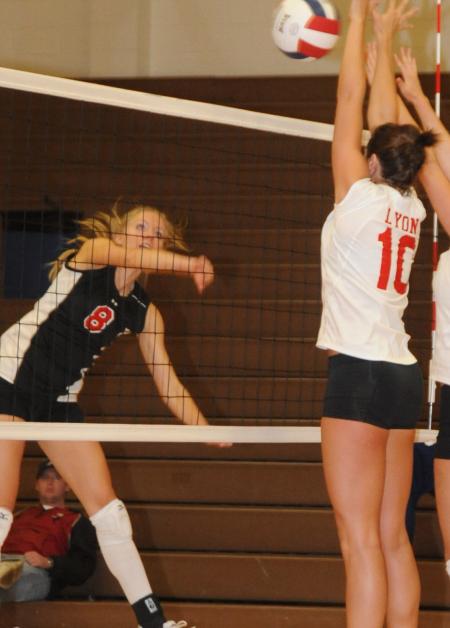 Amanda Hutchison Coyle goes for a kill in Union's conference tournament win over Lyon. - Photo by Morris Abernathy