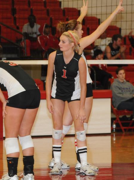Katie Adams with her fellow teammates look on in anticipation of the serve during the championship game of the TranSouth Conference Tournament. - Photo by Morris Abernathy